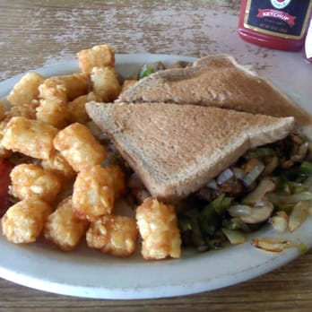 Mr. Quick - Craig's Famous Chopped Steak sandwich, with a side of tots. - Breakfast & Brunch Near Me - Orlando, Florida Mr. Quick - Craig's Famous Chopped Steak sandwich, with a side of tots. - Breakfast & Brunch Near Me - Orlando, Florida