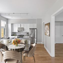 Cathedral Commons - Caesarstone quartz countertops & kitchen island in Townhome residences.