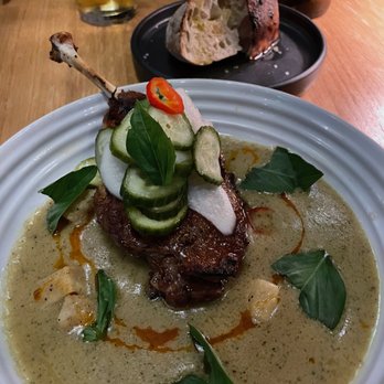 The Wolf's Tailor - duck confit over curry with house pickles and the best bread ever - New American Near Me - Denver, Colorado The Wolf's Tailor - duck confit over curry with house pickles and the best bread ever - New American Near Me - Denver, Colorado