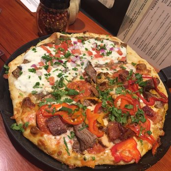 Moose's Tooth - half Santas little helper & half Greek Gyro - Pizza Near Me - Anchorage, Alaska
