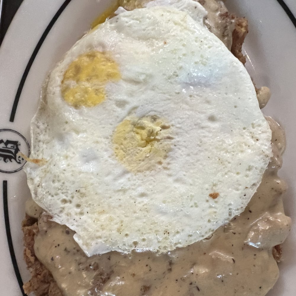 Bosscat Kitchen & Libations - country fried steak: topped w/ white gravy topped with eggs = $19 - Bars Near Me - Orange, California Bosscat Kitchen & Libations - country fried steak: topped w/ white gravy topped with eggs = $19 - Bars Near Me - Orange, California