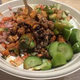 Built my own bowl: White rice, tzatziki, chicken, vegetables, cucumber & tomato, drizzled with hot Marsala vinaigrette