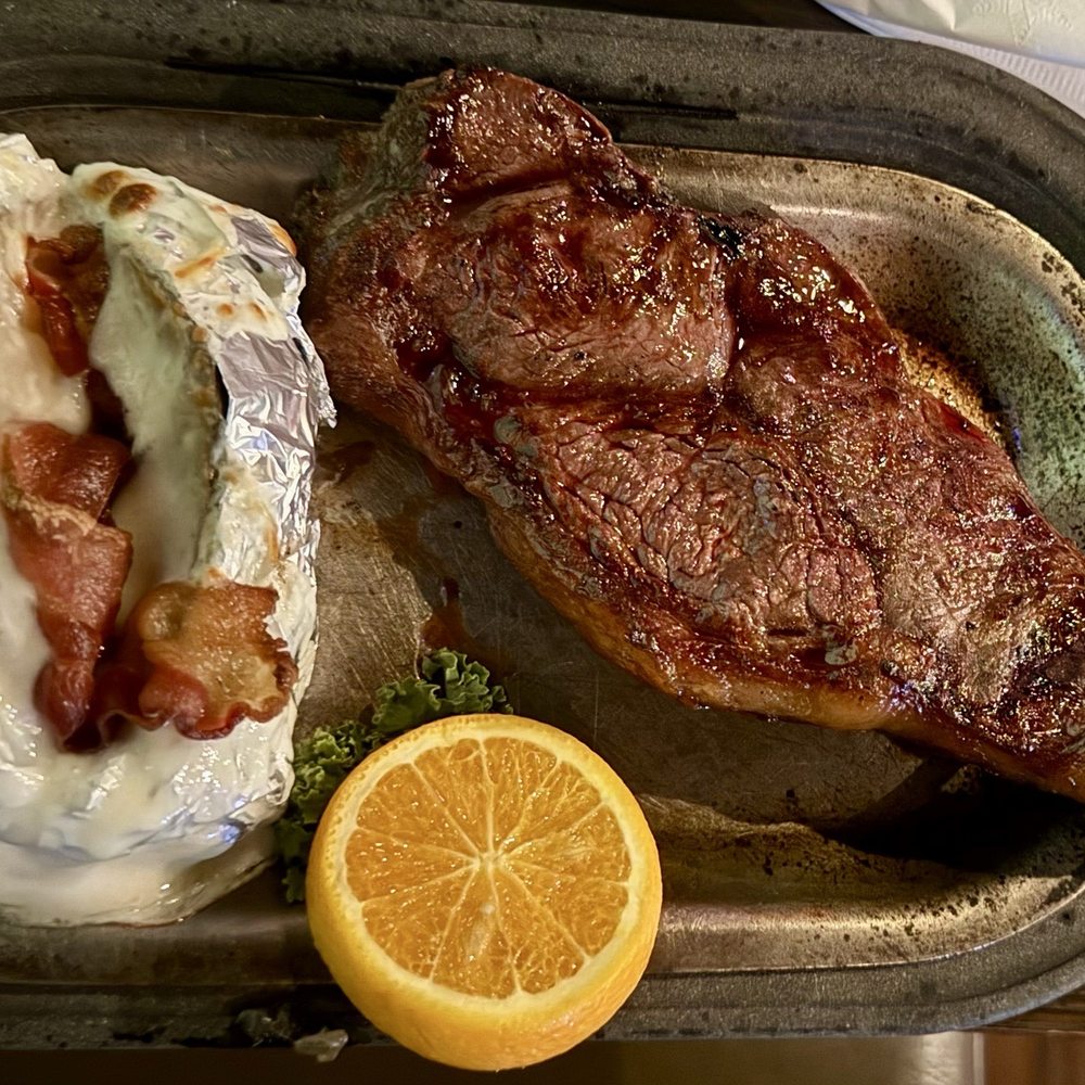 Adobe Deli - NY strip with loaded baked potato - Steakhouses Near Me - Deming, New Mexico Adobe Deli - NY strip with loaded baked potato - Steakhouses Near Me - Deming, New Mexico