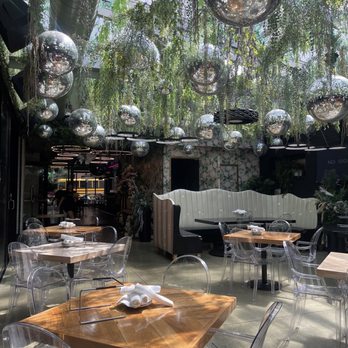 Lost Never Found - Patio area where we sat. Love the natural sunlight coming in! - Bars Near Me - Chicago, Illinois