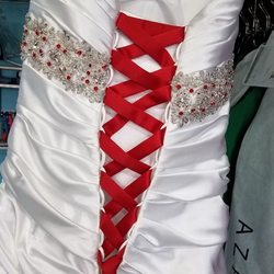 Leia's Dreamworks - Added a corset and red stones to a wedding gown