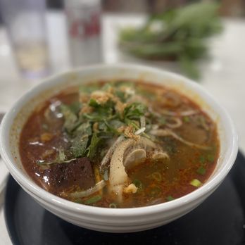 Kieu Vietnamese Cuisine - a bowl of soup on a plate - Vietnamese Near Me - Honolulu, Hawaii Kieu Vietnamese Cuisine - a bowl of soup on a plate - Vietnamese Near Me - Honolulu, Hawaii