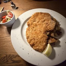 Schnitzel, Fried Potatoes and Cucumber Salad
