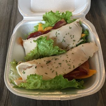 Happy Cafe - 2 of my 4 turkey/bacon/cheddar lettuce wraps.  These are going home with me.  Bill total was $5.99! - Cafes Near Me - Virginia Beach, Virginia