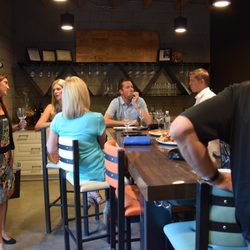 Vinum 55 - Members enjoying our beautiful tasting room, appointed with varietal specific Riedel glassware.