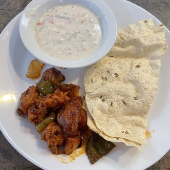 New India Palace - Chili chicken, Raita and fried papadum - Indian Near Me - Canoga Park, California