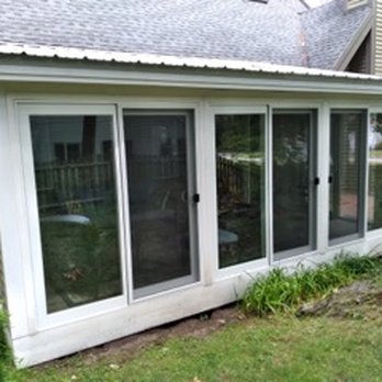 SCC Construction - a patio with a sliding glass door - Decks & Railing Near Me - Biddeford, Maine SCC Construction - a patio with a sliding glass door - Decks & Railing Near Me - Biddeford, Maine