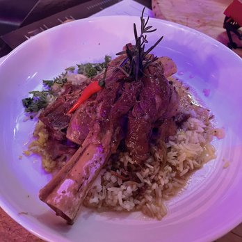 Deluxe Fun Dining - Slow Cooked Lamb Shank over Pineapple fried rice - Bars Near Me - Charlotte, North Carolina Deluxe Fun Dining - Slow Cooked Lamb Shank over Pineapple fried rice - Bars Near Me - Charlotte, North Carolina