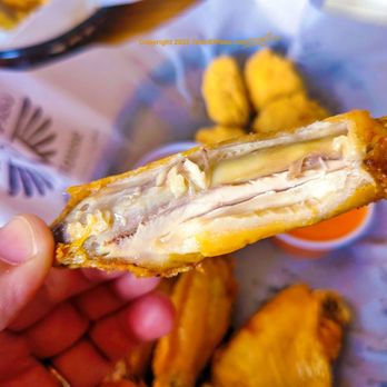 El Paso Wing House - a hand holding a chicken wing - Chicken Wings Near Me - El Paso, Texas El Paso Wing House - a hand holding a chicken wing - Chicken Wings Near Me - El Paso, Texas