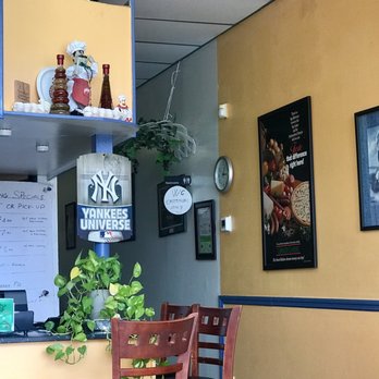 Paulis Pizza - Front Counter with "Yankees Universe " sign - Italian Near Me - Dania, Florida Paulis Pizza - Front Counter with "Yankees Universe " sign - Italian Near Me - Dania, Florida