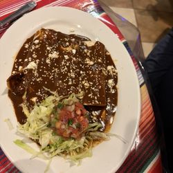 Mexican Grill - Chicken enchiladas with molé sauce.