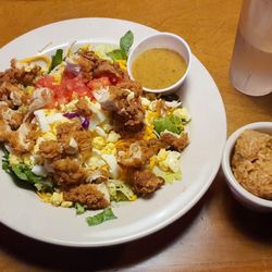 Texas Roadhouse - The chicken critter salad and a side of seasoned rice at Texas Roadhouse.