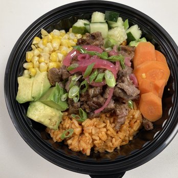 Dozzy's Grill - Jollof is the one-pot dish that unites all of West Africa. The Designer Jollof is made with long grain rice, cooked in tomato sauce - African Near Me - Chicago, Illinois Dozzy's Grill - Jollof is the one-pot dish that unites all of West Africa. The Designer Jollof is made with long grain rice, cooked in tomato sauce - African Near Me - Chicago, Illinois