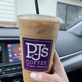 PJ's Coffee - a hand holding a cup of coffee - Coffee & Tea Near Me - Broussard, Louisiana PJ's Coffee - a hand holding a cup of coffee - Coffee & Tea Near Me - Broussard, Louisiana