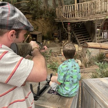 Big Cypress Lodge - Husband and kid at target arcade. - Hotels Near Me - Memphis, Tennessee