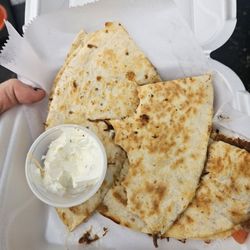 El Hombres Taco - Carnita quesadilla with sour cream