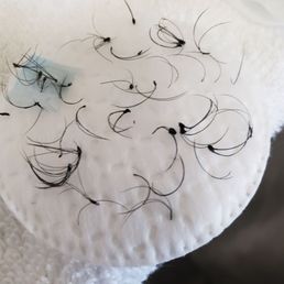 The clumps of glue and lashes that were removed The clumps of glue and lashes that were removed
