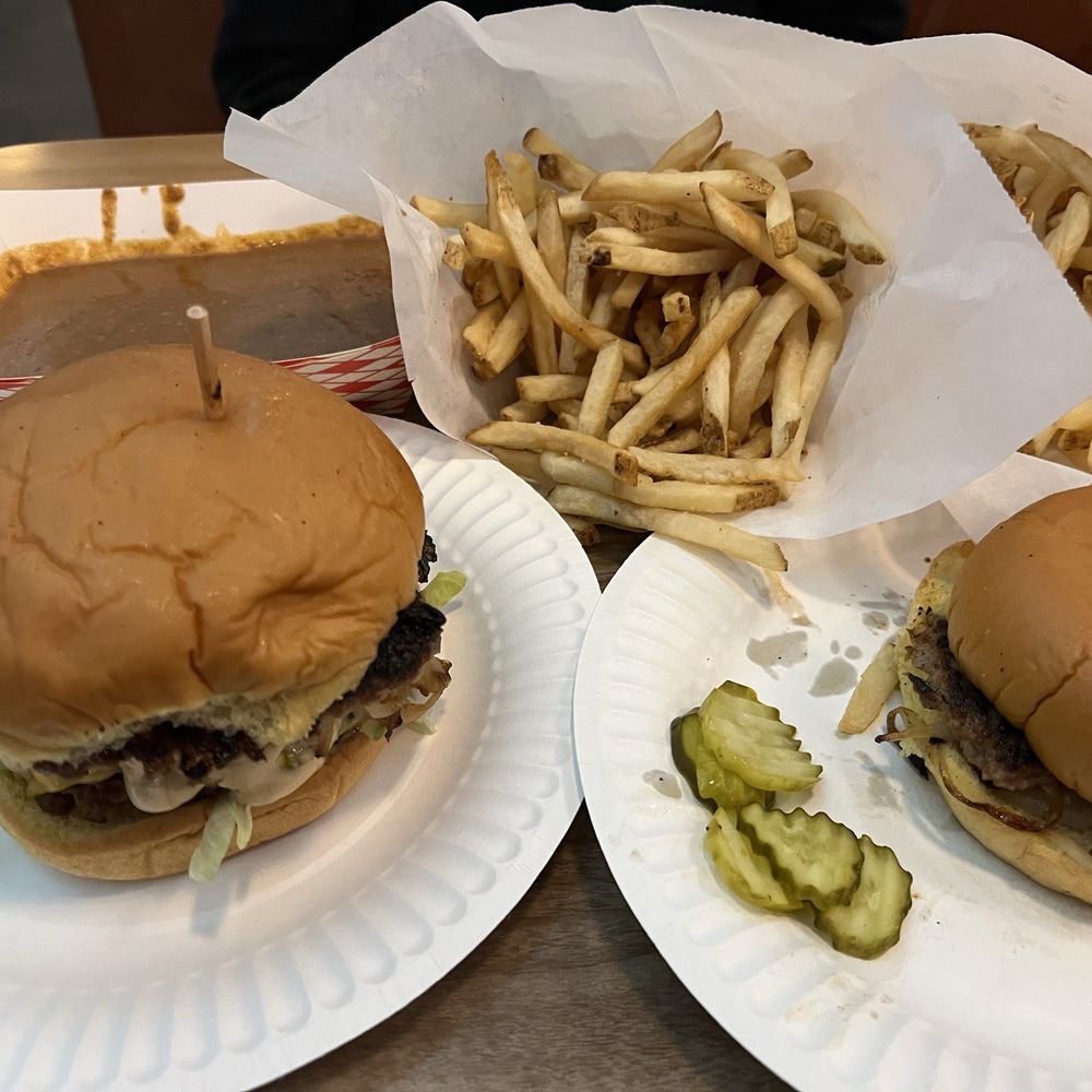 Sun Cattle - The Big Jack burger (left), a "bowl" of chili. French fries and a regular cheeseburger. - Burgers Near Me - Oklahoma City, Oklahoma Sun Cattle - The Big Jack burger (left), a "bowl" of chili. French fries and a regular cheeseburger. - Burgers Near Me - Oklahoma City, Oklahoma