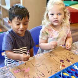 Argyle Fine Arts Preschool - Working on fine motor while polishing nails