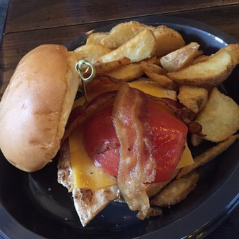 Leaky Cauldron™ - Chicken sandwich with wedges. Very good - British Near Me - Orlando, Florida Leaky Cauldron™ - Chicken sandwich with wedges. Very good - British Near Me - Orlando, Florida