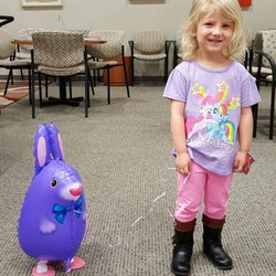 Pediatric Dentistry of West Sacramento - Happy patient with her bunny balloon!