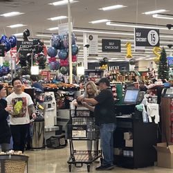 Safeway - The blonde woman and the man in the black shirt.