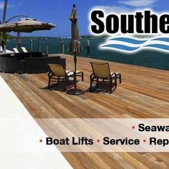 Southeast Marine Construction - a dock with chairs and umbrellas - General Contractors Near Me - Tavernier, Florida