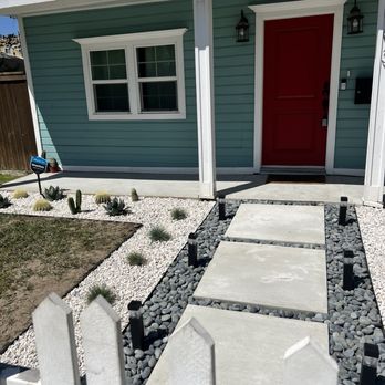 Castillo Landscaping - Front yard with a walkway featuring custom pavers, two unique types of gravel, and drought-resistant plants. - Landscaping Near Me
