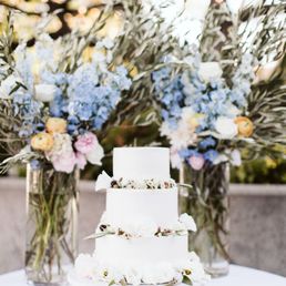 Lovely alter pieces that got reused for the cake table and delicate florals for the cake