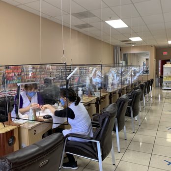 Signature Nails Spa - Manicure area with acrylic barriers and wear of masks... - Nail Salons Near Me - Seaside, California Signature Nails Spa - Manicure area with acrylic barriers and wear of masks... - Nail Salons Near Me - Seaside, California