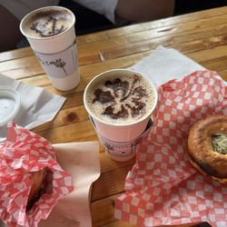 Islands Café - Palm Tree Latte, Beach Bum Latte both with oat milk and 2 sandwiches both substituted with an Everything Bagel)