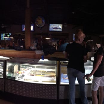 Chester's Reef - a group of people standing in line at the counter - Bars Near Me - Sarasota, Florida