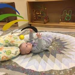 Alta Vista Montessori School - A 5 month old baby working on hand eye coordination!