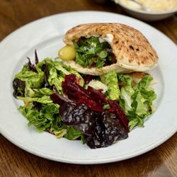 Cafe Mogador - Tunisian Pita Sandwich, stuffed with house-made spicy merguez sausage