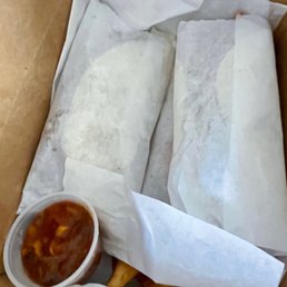 Fish tacos wrapped with salsa and steak fries Fish tacos wrapped with salsa and steak fries