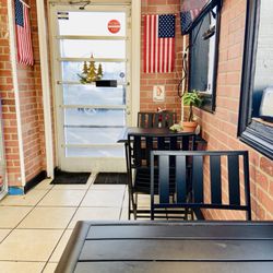 Zaki Mediterranean Grill - Tables and front door