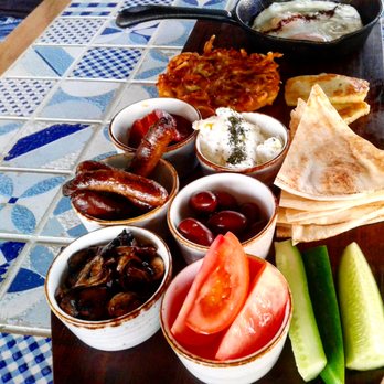 The Woods Pantry - Breakfast Mezze:  EggsLebanese Beef Sausages, Potato Rosti, Haloumi, Marinated Mushrooms, Labneh, Cucumber, Olive, Tomato & Flatbread - Cafes Near Me - Villawood, NSW