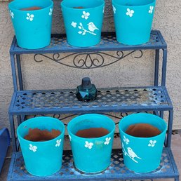 Donated pots and plant stand. Donated pots and plant stand.
