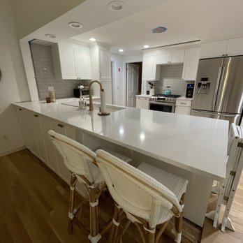 Greenmen Builders - a kitchen with a large island - General Contractors Near Me Greenmen Builders - a kitchen with a large island - General Contractors Near Me