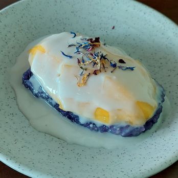 Dok Mali Thai Kitchen - Delicious sweet mango on purple sticky rice. - Thai Near Me - Portland, Maine Dok Mali Thai Kitchen - Delicious sweet mango on purple sticky rice. - Thai Near Me - Portland, Maine