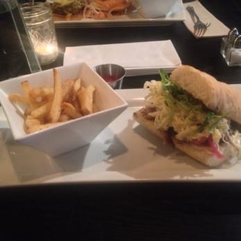 The State - Pork Belly sandwich with bomb a$@ fries! They were really good!!! But...... That is the portion they gave me BEFORE I ate any!! - New American Near Me - Redlands, California