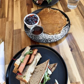 Folktale Coffee & Bakehouse - Fried Bologna sandwich (full), sourdough pancake (with berries), BLT (half) - Coffee & Tea Near Me - Corbin, Kentucky