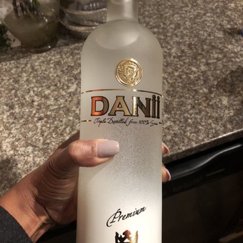 Wing Depot - a hand holding a bottle of vodka - Chicken Wings Near Me - Atlanta, Georgia