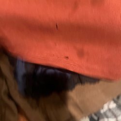 Village Laundromat - Clothing damaged from gash in dryer tumbler.