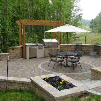 Life Time Pavers - a patio with a grill and seating area - Landscaping Near Me Life Time Pavers - a patio with a grill and seating area - Landscaping Near Me
