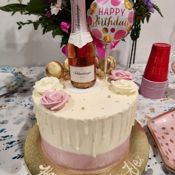 Lavender Bakery & Cafe' - Custom ordered cake; only decorated.  I supplied the bottle and balloon.  Very pretty but not tasty at all. - Cafes Near Me - Berkeley, California